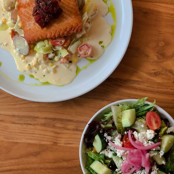 Salad of some plate with cooked fish